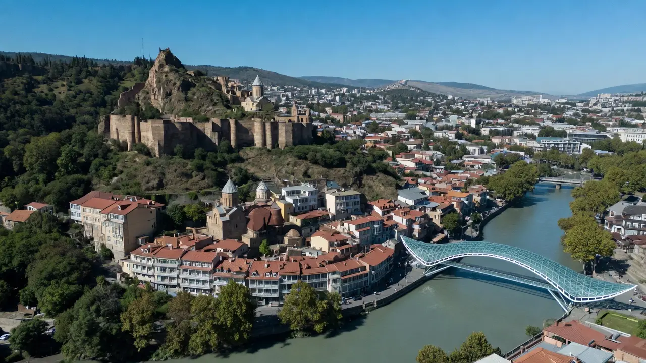 Aerial view of Tbilisi Old Town with Narikala Fortress and the Kura River on a sunny day